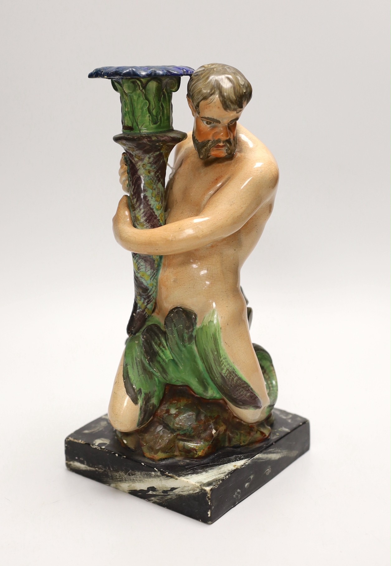 A pearlware ‘Triton’ figural candlestick, attributed to Wood & Caldwell, c.1800, 24cm, after a design by John Flaxman